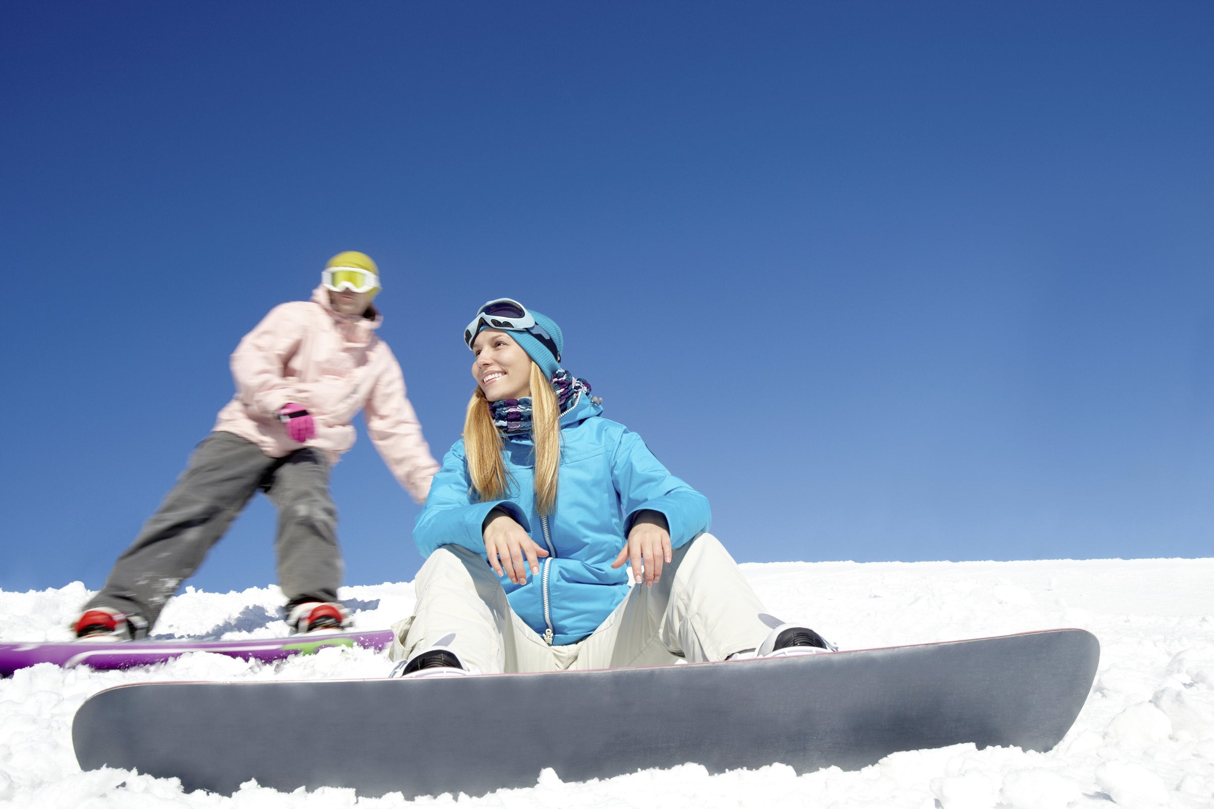 Woman skiier wearing a pair of snowboard socks